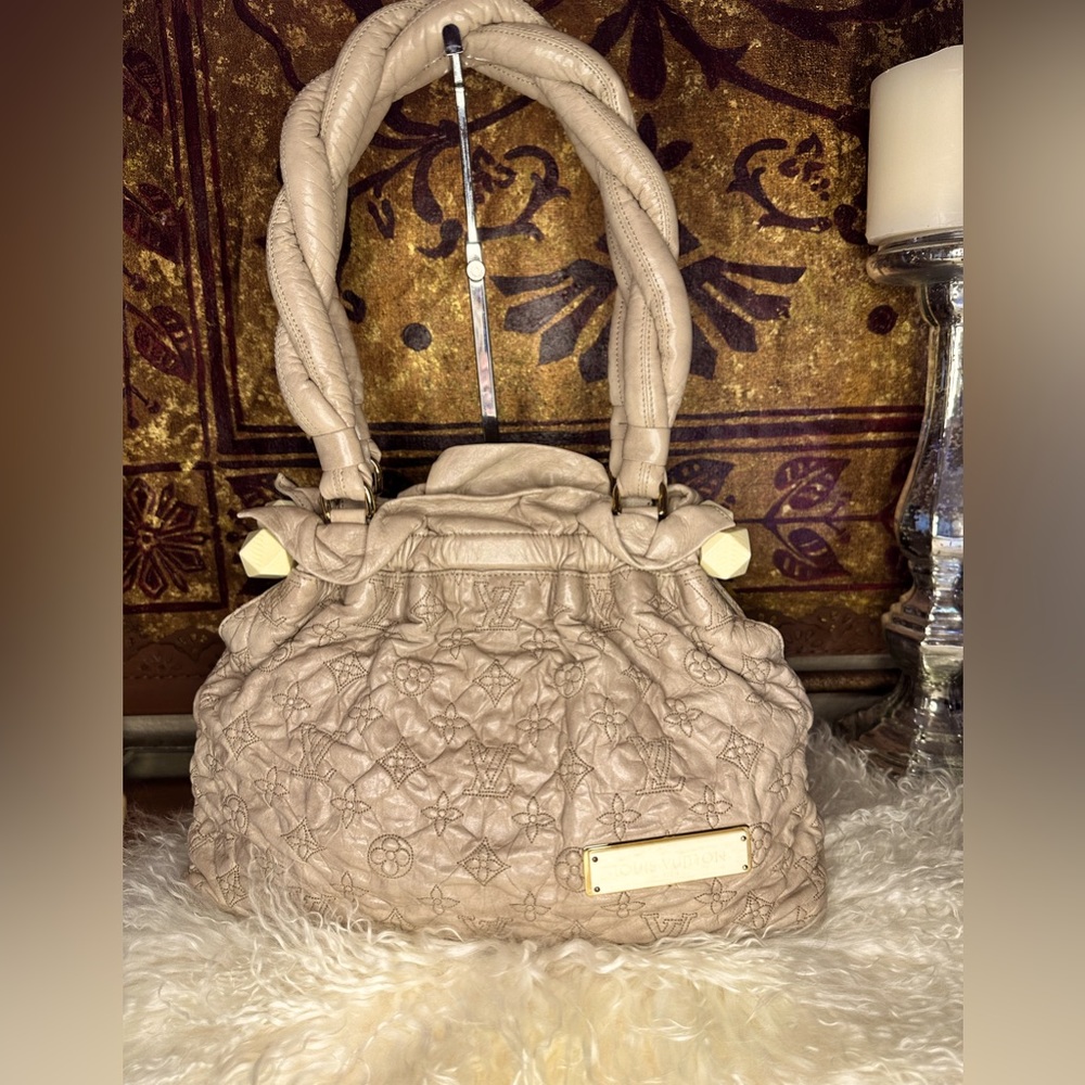 Louis Vuitton Olympe Stratus
Handbag Limited Edition monogram lambskin pm